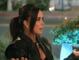 Kyle Richards' White Half Sleeve Top and Printed Cardigan