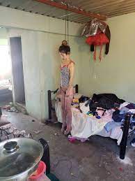 Dead tree covered in womens bras. Two Young Mexican Women Hanged Half Nude