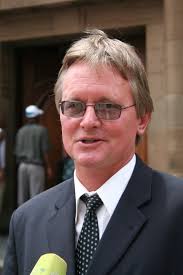 Lawyer charged with assault for pointing his finger at cop