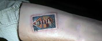 Stamps can be a fun way to create memories. 20 Postage Stamp Tattoo Designs For Men Traveler Ink Ideas