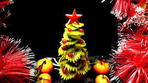 Add pomegranate seeds randomly all over the arranged fruit to look like ornaments. Kiwi Christmas Tree Kiwi Carving Fruit Garnish Kiwi Art Fruit Decoration Youtube