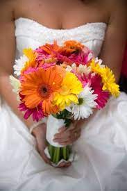 Daisy wedding cakes make a charming impression, they illicit purity and innocence in a wedding party. Gerbera Daisy Bridal Bouquet