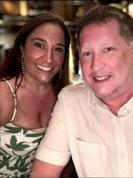 Can someone remove the lanyard from my husband's neck in this photo?