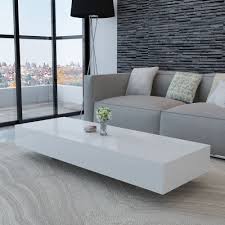 A Seemingly Floating Coffee Table In White Perfect Modern Coffee Table For A Whit White Coffee Table Modern Modern Furniture Living Room Furniture Side Tables