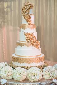 Use elaborate masks and beaded necklaces in your décor, and go for a purple, green, and gold color scheme. 21 White And Gold Wedding Ceremony Reception Ideas Inside Weddings