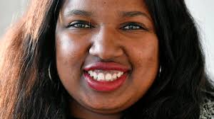 Shovonnia Corbin-Johnson speaks while waiting for 10th District primary  results