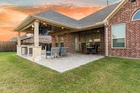 Hip Roof Patio Cover Attached To The House With Outdoor Kitchen And Travertine Tile Flooring Outdoor Remodel Patio Design Outdoor Covered Patio