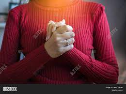 While some believe that hands clasped in front are a sign of confidence others believe that it is actually a sign of frustration. Woman Hand Praying Image Photo Free Trial Bigstock