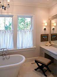The curtain and bows are of same colour but still looking incredible. Half Curtain Bathroom Windows Roman Shades Bathroom Half Baths Ideas