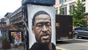 Surveillance video from cup foods shows a man wearing a face mask over a ski mask walk up. Three Arrested After George Floyd Mural Damaged Granada Itv News