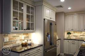 New hardware, such as gem's diy leather pulls, also go a long way to refreshing a kitchen. Waypoint 660r Cabinets In Painted Hazelnut Glaze And Granite Absolute Black Countertops Glazed Kitchen Cabinets Kitchen Cabinets Black Countertops