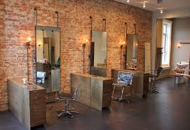 Exposed Brick Wall Mounted Fixtures With Exposed Conduit Industrial Feel With The Metal Mirror Hanging Fi In 2020 Hair Salon Interior Beauty Salon Decor Rustic Salon