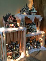 Let these decorations bring out the true christmas spirit in your home! My 2015 Village Display Made Using Crates Christmas Lights And Snow Christmas Village Display Christmas Apartment Indoor Christmas Decorations