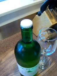 Use your index finger's knuckle as a fulcrum, wedge the lighter between it and the underside of the bottle cap, and use the same motion as a regular bottle opener. Pop Top Wine Bottle The Uncorked Life