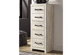 A tall chest of drawers is perfect for this purpose. Cambeck Narrow Chest Of Drawers Ashley Furniture Homestore