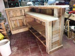 Use a scratch awl or a nail to make a dent in the wood at the location where the screws should go. Diy Bar From Pallets Novocom Top