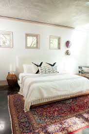 Queen size bed and single bed. A Simple Guide To Rugs In The Bedroom