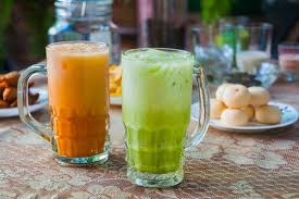 Tea expert john bickel discusses tea in thailand, covering topics such as fake teas, real thai teas, thai iced tea, chatramue thai teas. Cha Thai Thai Iced Tea And Iced Green Tea With Plate Of Thai Mochi Sweet Dessert Ingredients On The Table Selective Focus Stock Photo Adobe Stock