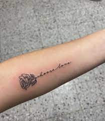 Roses are by far one of the most popular tattoo designs for both men and women to get. Rose Tattoo Choose Love Rose Rib Tattoos Rose Tattoos For Women Word Tattoos On Arm
