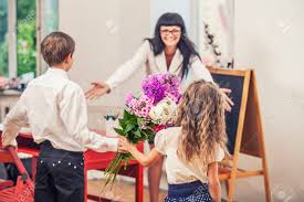 So, for teacher appreciation day this year, consider sending some flowers, along with this sweet printable, that your child can color in. Boy And Girl Children Give Flowers As A School Teacher In Teacher S Stock Photo Picture And Royalty Free Image Image 42917981