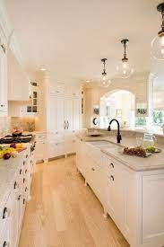 Whether teaching an old family recipe, reading the newspaper in a breakfast nook, or chatting over the daily morning coffee, the ritual of the everyday begins here. Amazing Kitchen With Light Wood Floors And Fun Lighting Www Remodelworks Com Home Kitchens Home Beech House