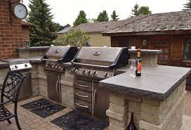 Grilling Station And Outdoor Kitchen Area With Backsplash And Natural Stone Countertops Outdoor Kitchen Countertops Outdoor Kitchen Outdoor Kitchen Design