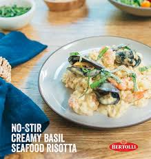 No Stir Creamy Basil Seafood Risotto Recipe Bertolli Recipe Seafood Risotto Food Risotto Recipes
