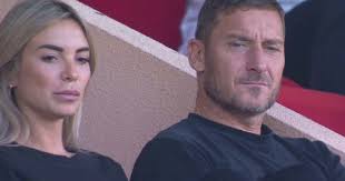 Totti and his new girlfriend are no longer hiding, they are seen together  in the stadium, but not in Italy