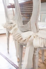 Don't reupholster your dinning room chairs with fabric and staples just use these inexpensive slipcovers for your dining room chairs. Dining Chair Slipcover Tutorial Miss Mustard Seed