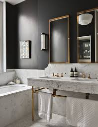 It is a style that incorporates dark moody tones, rugged woods, industrial metal accents, textured stone, and aged materials. Black Bathroom Masculine Bathroom Marble Brass And Off Black Schoolhouse Fixture Bathroom D Marble Bathroom Designs White Bathroom Designs Bathroom Trends