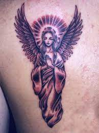 I D Get An Angel On My Shoulder With My Grandmother S Name Underneath Angel Tattoo Designs Guardian Angel Tattoo Designs Tattoos For Women