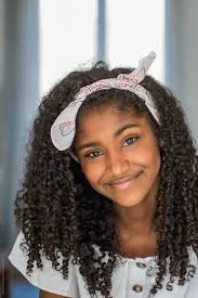 Portrait Of A Beautiful Young Black Teenage Girl Looking Into Camera" by  Stocksy Contributor "David Prado"