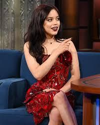 Jenna Ortega wore a glass dress from Oscar de la Renta while appearing on  “The Late Show with Stephen Colbert.” “I'm not going to lie, there are  pieces of glass that are