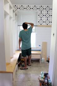 The hall tree includes a bench with storage inside for shoes, hats and gloves. How To Build An Entryway Bench With Hooks And Storage Just Measuring Up
