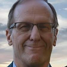 It is with great sadness that we announce the passing of John Houchin. John  was a dedicated member of the Salem Lion's Club, the Salem Economic  Development Commission, and the Salem Democratic