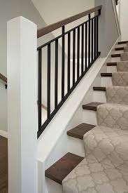 Wood And Iron Staircase Is Lined With A Gray Moroccan Tiles Stair Runner Idees Escalier
