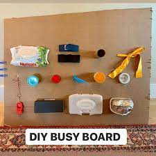 Need A Few Minutes Of Silence This Cardboard Diy Busy Board Will Do The Trick Keep Your Toddler Entertained Wit Diy Busy Board Busy Board Toddler Activities