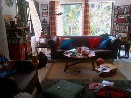 messy young bachelors living room designed and styled by niyoti bachelor room home decor home