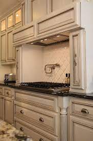 Amazing antique white kitchen cabinets with chocolate glaze. Live Beautifully April 2011 Antique White Kitchen Antique White Kitchen Cabinets Glazed Kitchen Cabinets