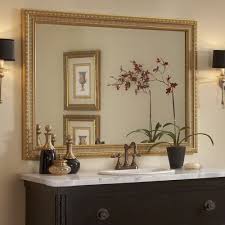 This Traditional Dark Wood Bathroom Showcases The Providence Gold Mirror Frame Atop The Wall Mounted Bathroom Mirrors Diy Mirror Frame Diy Gold Mirror Bathroom