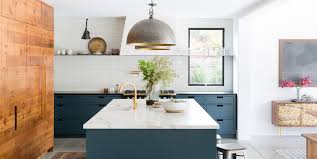 In this kitchen, buttery yellow paint (cued by the wood floor's golden undertones) softly warms the walls while showcasing cabinets finished in a deep khaki. Two Tone Kitchen Cabinet Ideas How Use 2 Colors In Kitchen Cabinets
