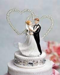 This Deluxe Wedding Cake Top Hallmarks An Elegant Fine Porcelain Wedding Couple With The Bri Heart Wedding Cakes Heart Wedding Cake Topper Wedding Cake Toppers