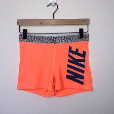 Black And Orange Nike Shorts Nike Pro Dri Fit Neon Orange Spandex Shorts With Navy Blue Nike Spell Out And Black And White Cheetah Waistband Nike Pro Spandex Nike Pros Spandex Shorts
