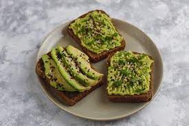Download Avocado Open Toast With Avocado Slices Lemon Flax Seeds Sesame Seeds Black Bread Slices Top View For Free Avocado Snack Avocado Toast Avocado Recipes