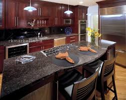 A kitchen featuring baltic brown granite countertops gets an urban feel with black lacquer cabinetry. Tan Brown Granite Best Tan Brown Granite Price Rk Marbles India