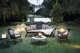 This courtyard garden is set up like an outdoor living room, complete with rug, wall lights and pendant lighting, and comfy, upholstered seating. Garden Design Ideas The Creative Furnishings By Alessandro La Spada Archi Living Com