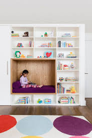 See all children's boxes & baskets 19 Cozy Nooks That Radiate Charm And Comfort Stylish Kids Room Reading Nook Kids Kids Room Shelves