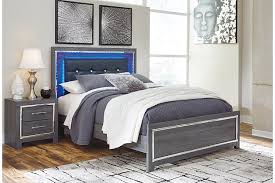 Wispy white finish over replicated oak grain. Lodanna Queen Panel Bed Ashley Furniture Homestore