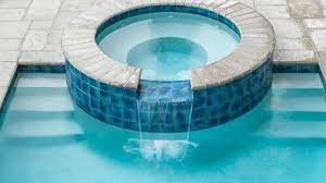 For the hot tub, there is a pump, heater, air jets, benches, and a cover. 33 Swimming Pool With Jacuzzi Design Examples