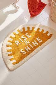 Good vibes win the day with this happy face bath mat. Rise And Shine Bath Mat Urban Outfitters